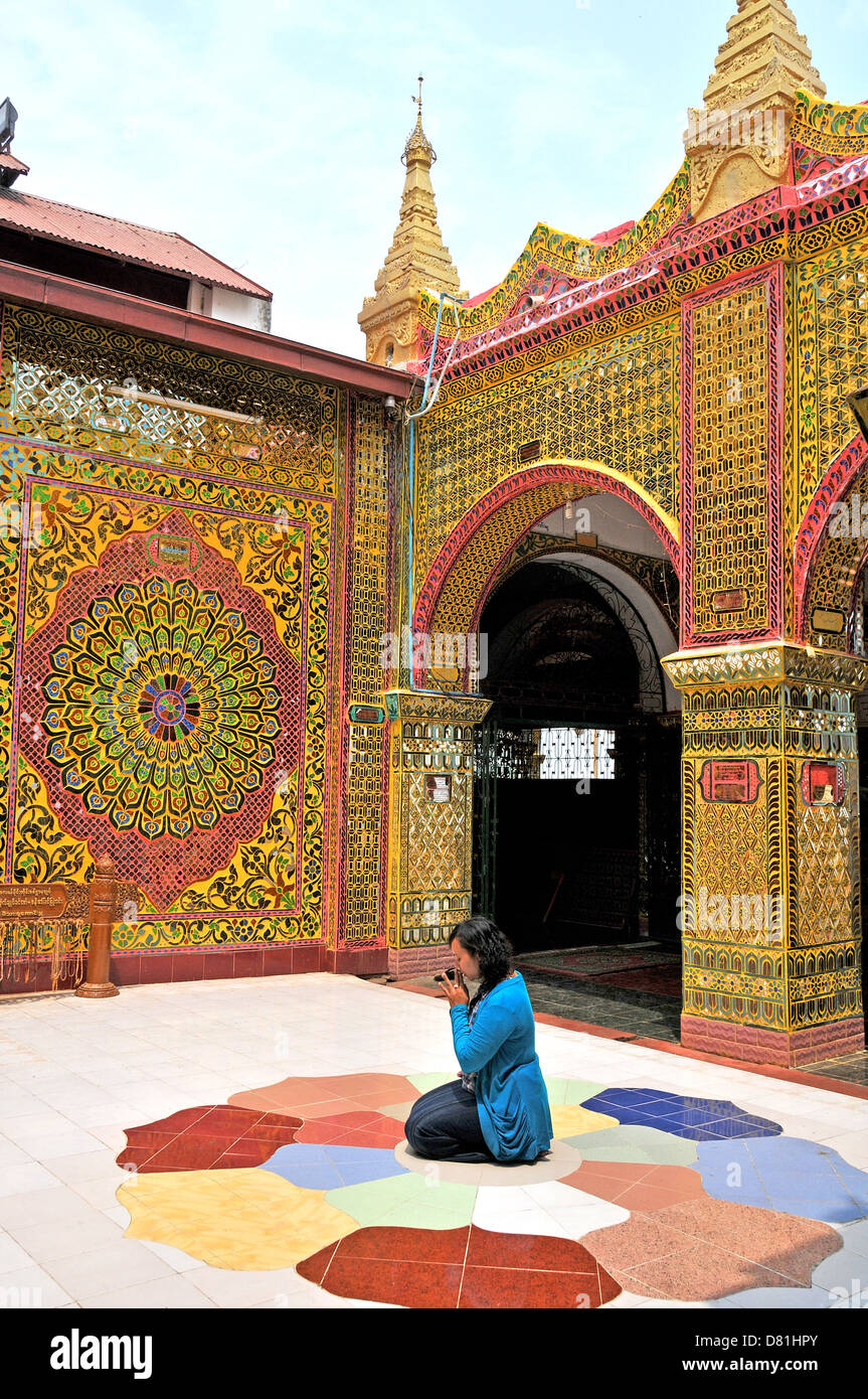 woman praying, Pyi Su Taung temple, Mandalay hill , Myanmar Stock Photo