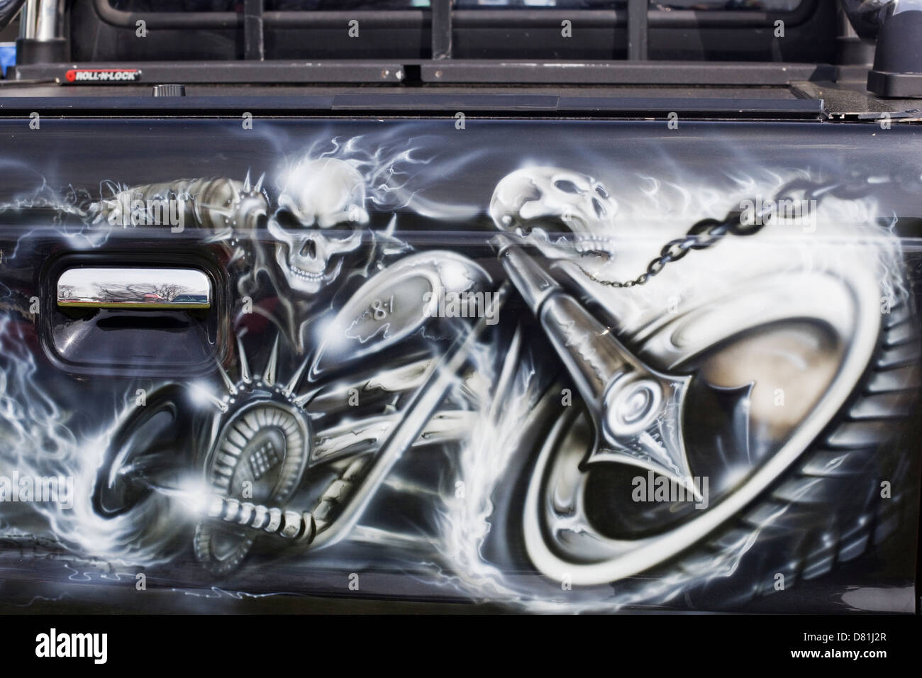 Customized Ford Pick up Truck spray painted with a skull and motorbike Stock Photo