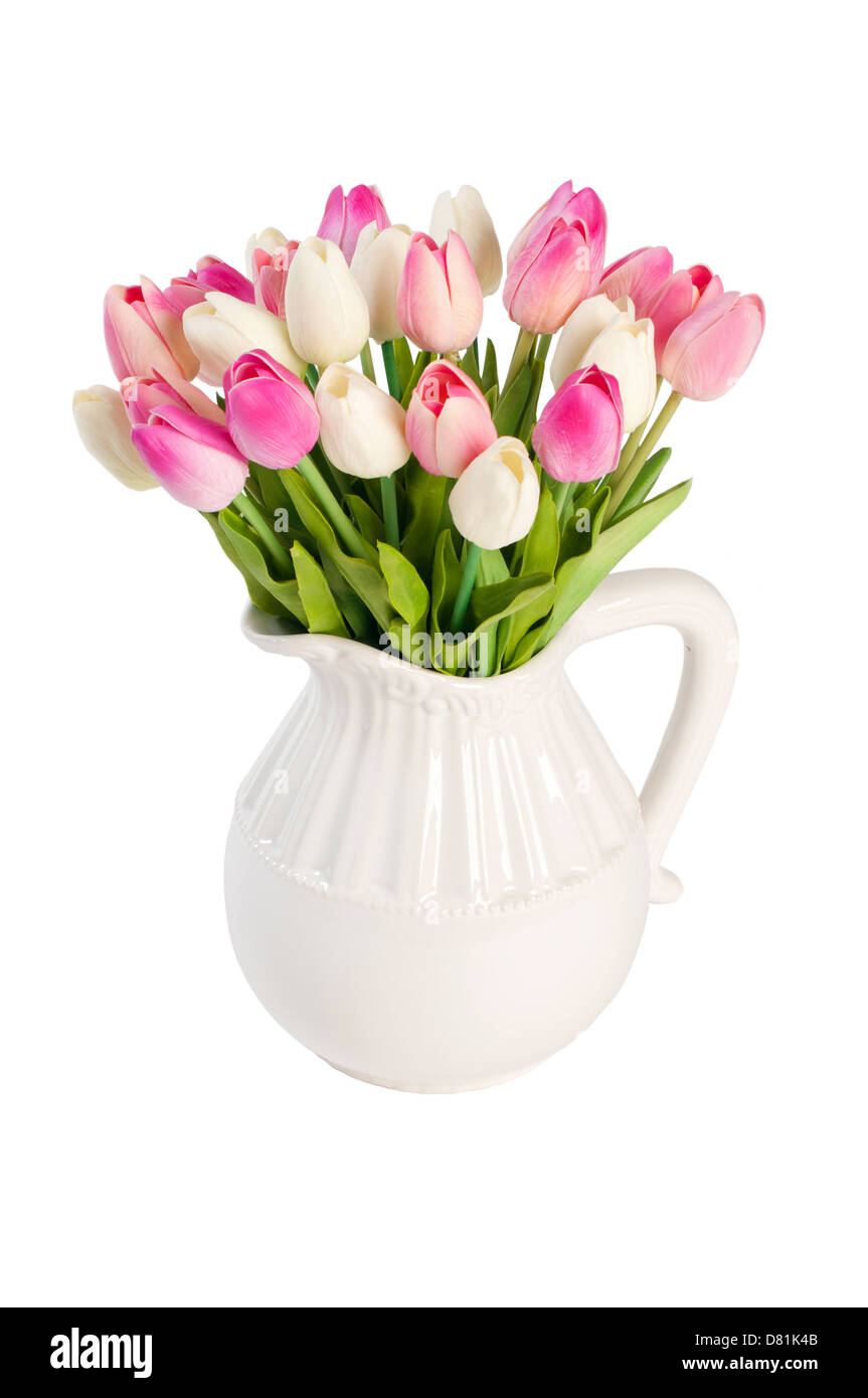white tulips in a vase on a white background Stock Photo - Alamy