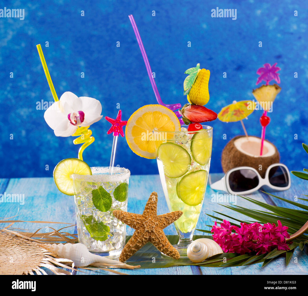 Mojito and lemon lime Cocktails in tropical Caribbean blue wood with ... Mojito and lemon lime Cocktails in tropical Caribbean blue wood with ...