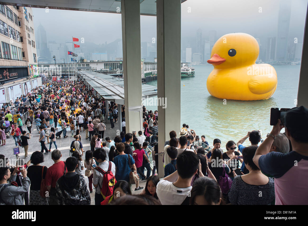 The big floating rubber duck by Dutch artist Florentijn Hofman in Victoria Harbour in Hong Kong. Stock Photo