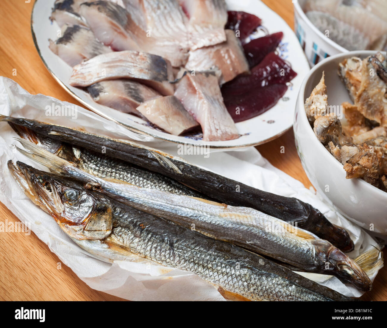 Assorted fish on wooden table. Seafood theme Stock Photo