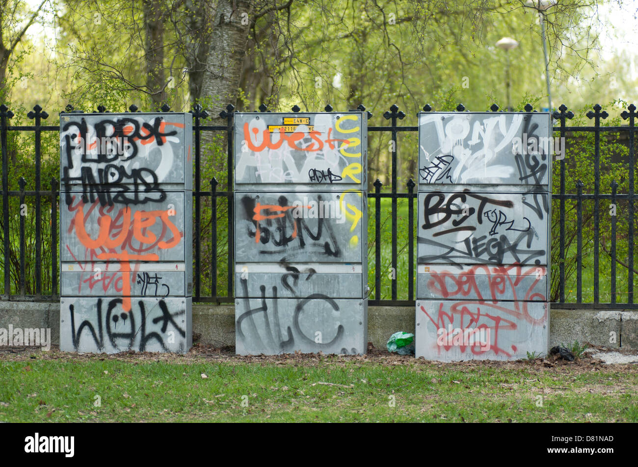 Massive graffiti on three electrical enclosures in a park Stock Photo