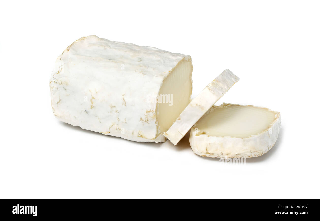 goats cheese cut in slices cut out onto a white background Stock Photo