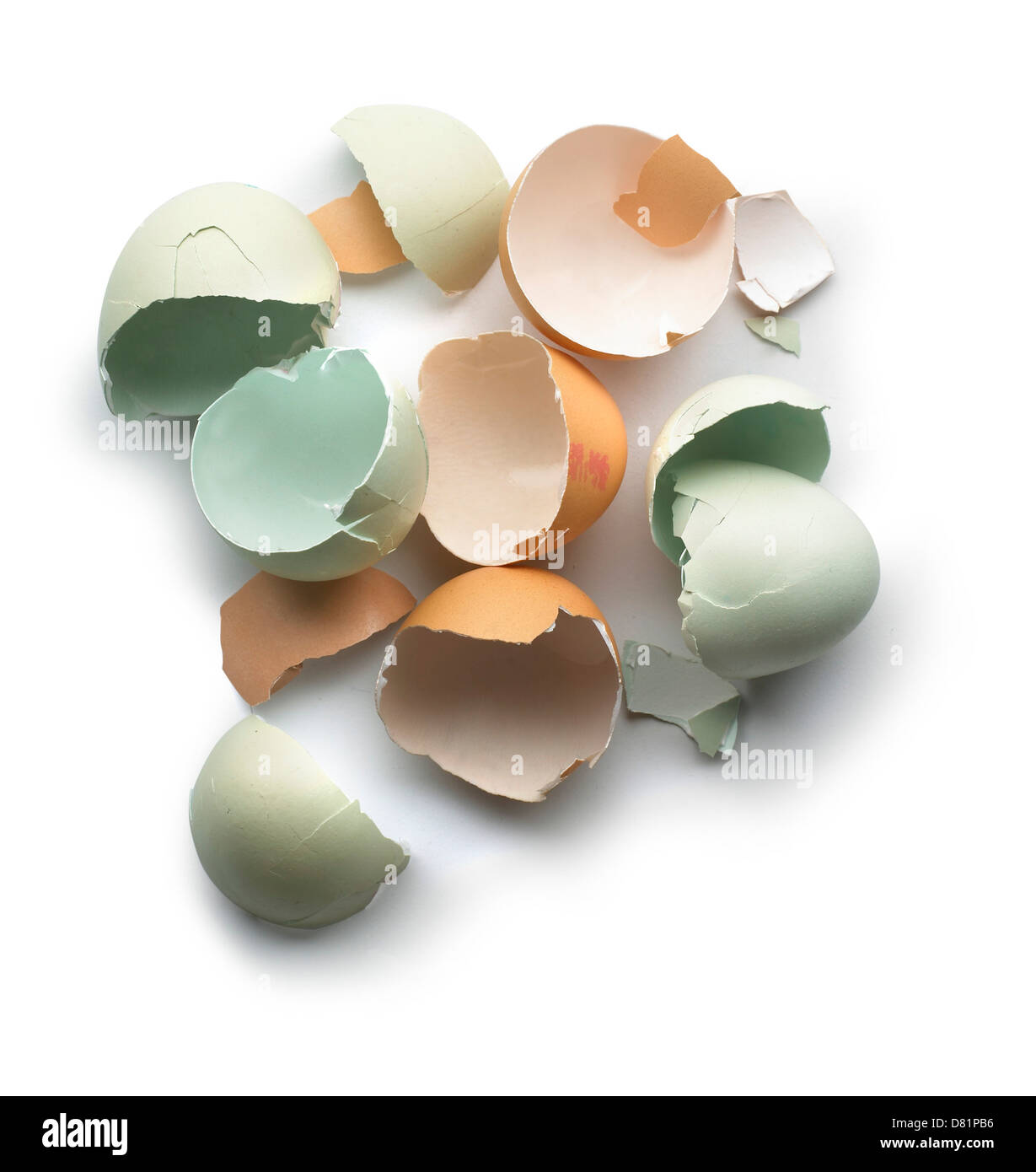Pile of broken eggshells cut out onto a white background Stock Photo