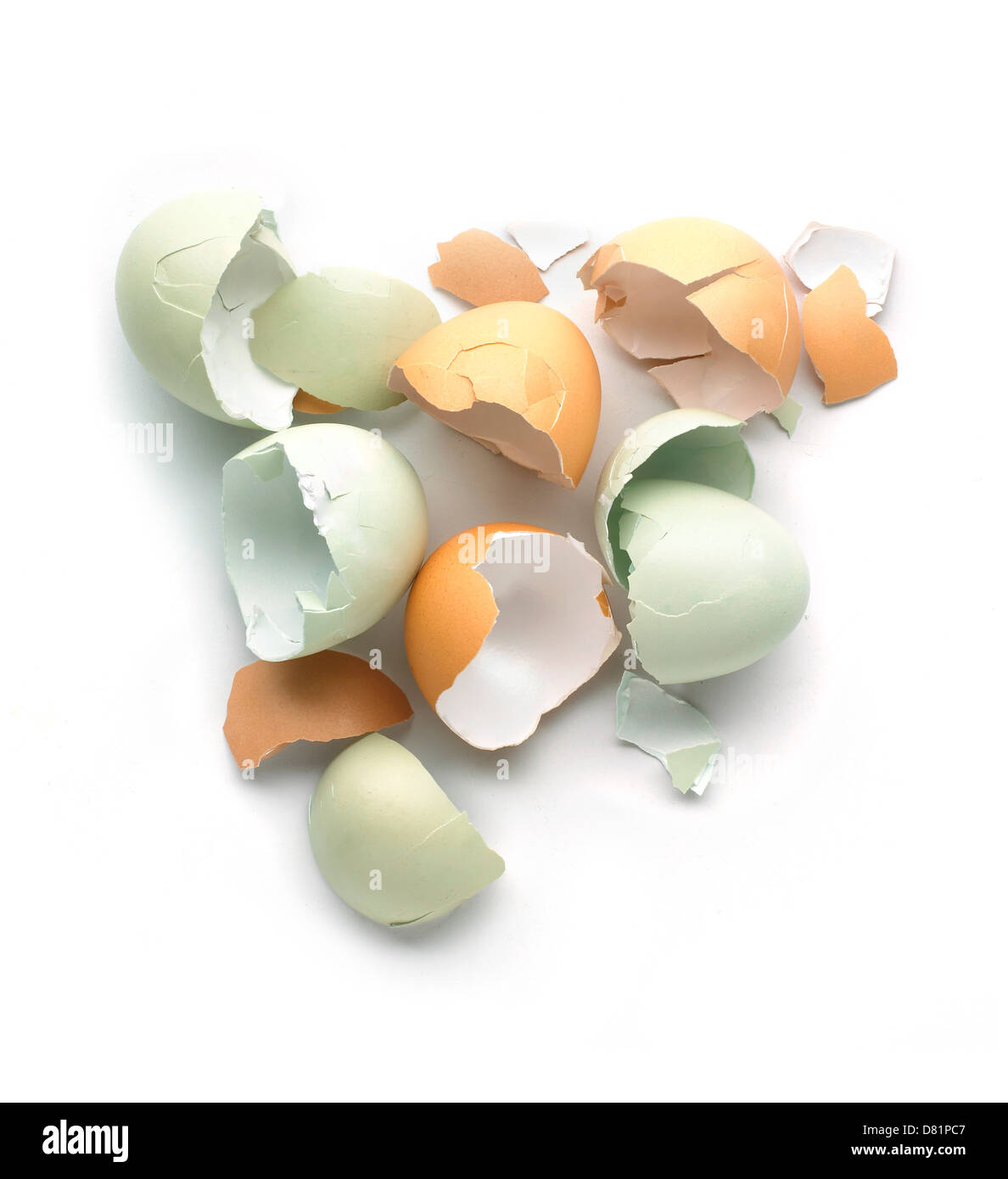 Pile of broken eggshells cut out onto a white background Stock Photo