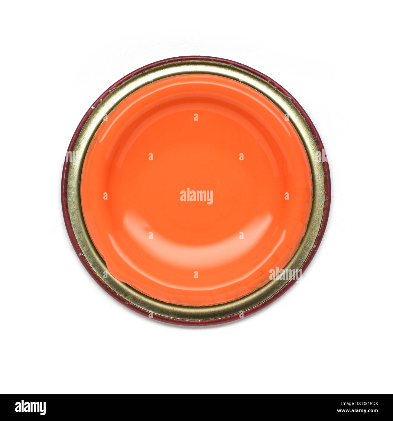 bright orange paint pot shot from above cut out onto a white background Stock Photo