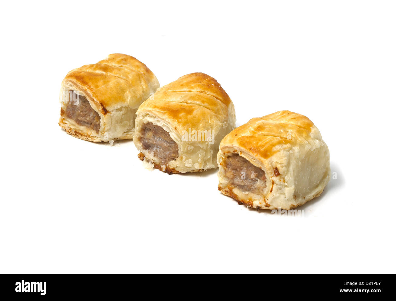 Mini sausage rolls cut out on a white background Stock Photo Alamy