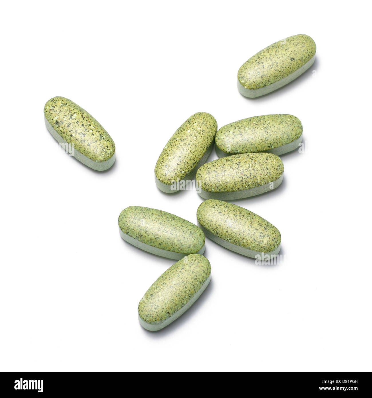 Group of green pills cut out white background Stock Photo