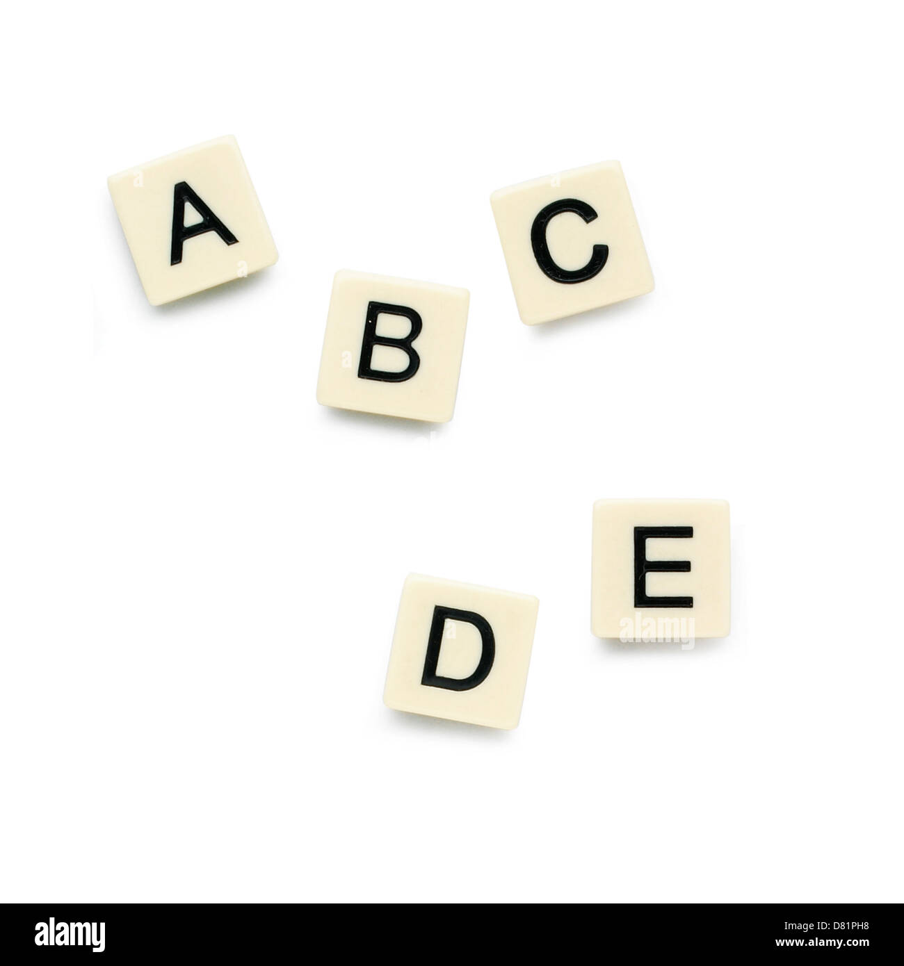 Five scrabble pieces cut out white background Stock Photo