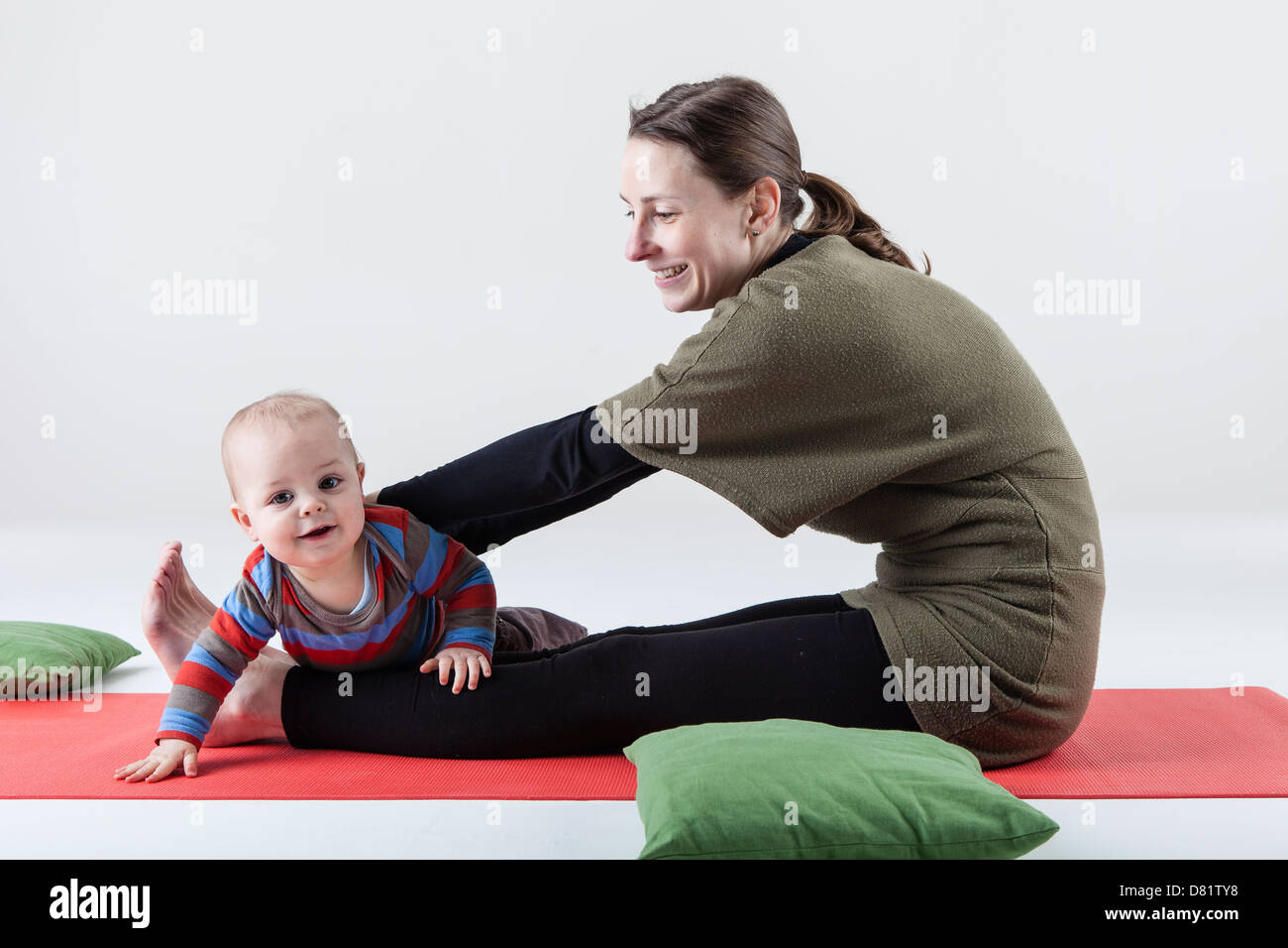 mother and child doing yoga Stock Photo