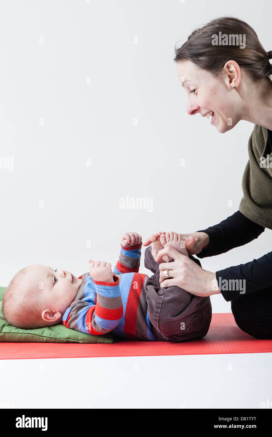 Mother and baby doing yoga exercises Stock Photo