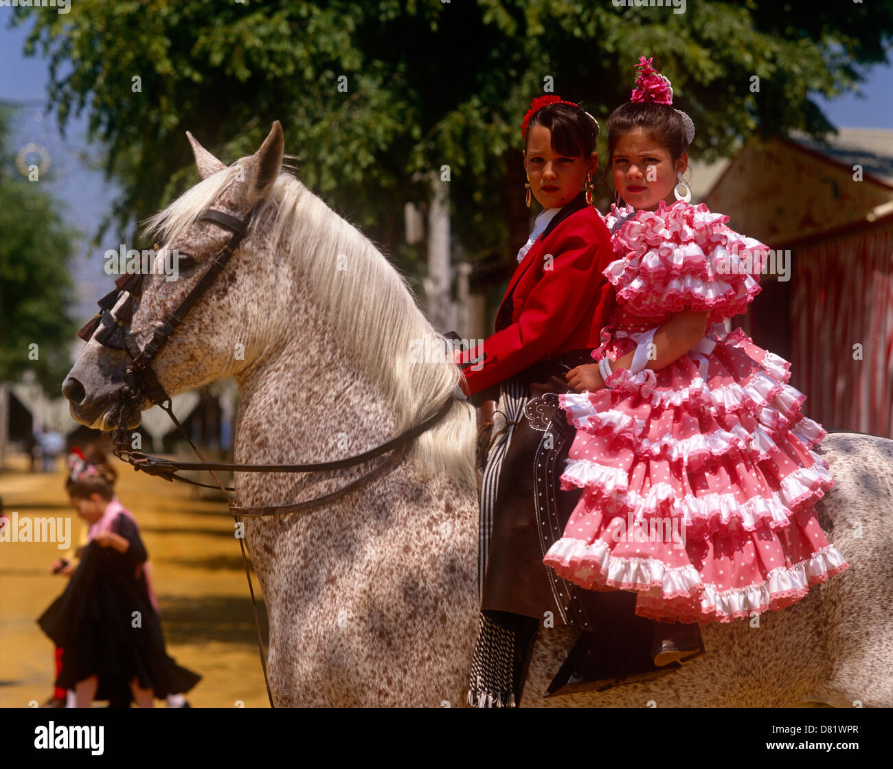 Spanish girls in National dress at the Feria (Horse Fair) in Seville,  Andalucia, Spain Stock Photo - Alamy