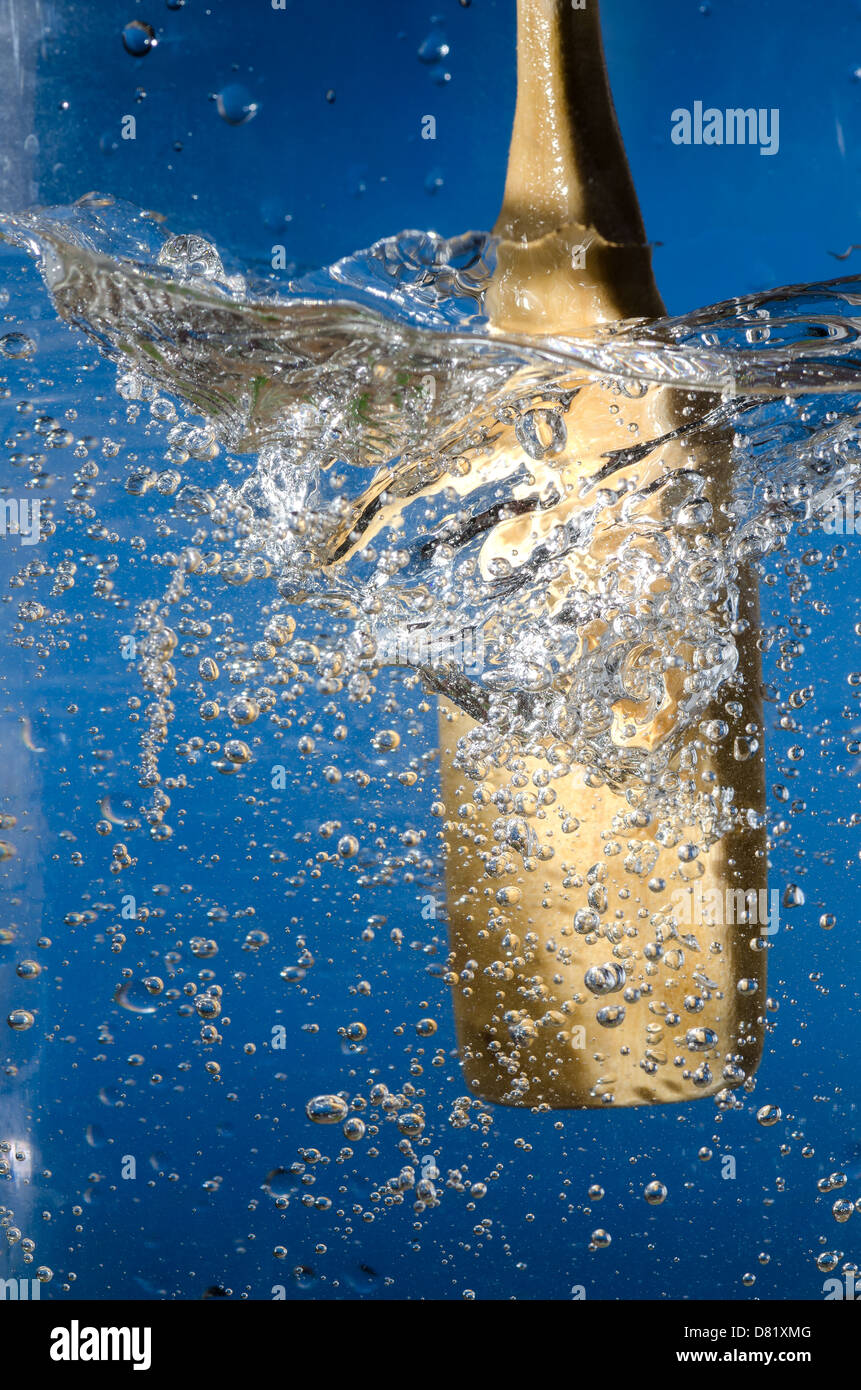 wooden spoon that creates a vortex in the water Stock Photo - Alamy
