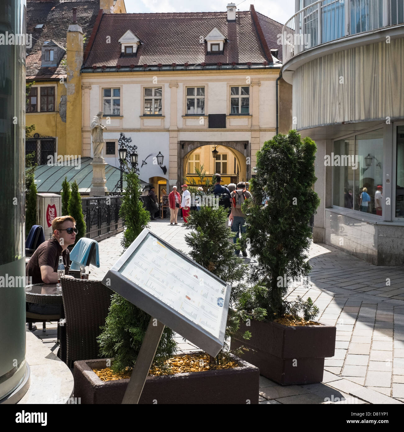 A young man in a coffee shop in Michalska street, Bratislava Stock Photo