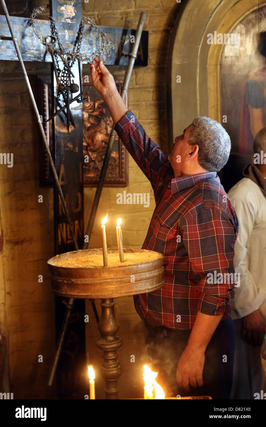 christian pilgrim in coptic St. Mari Girgis Church, Cairo Egypt Stock Photo