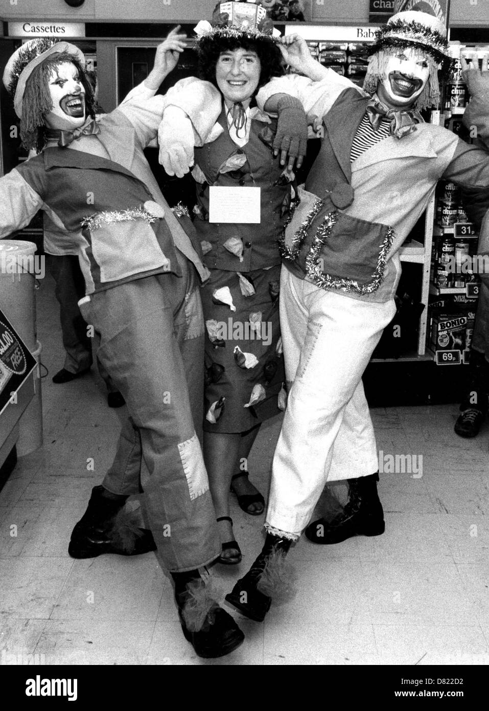 Clowns invade a shop during a late night shopping event in Lewes 1983 Stock Photo