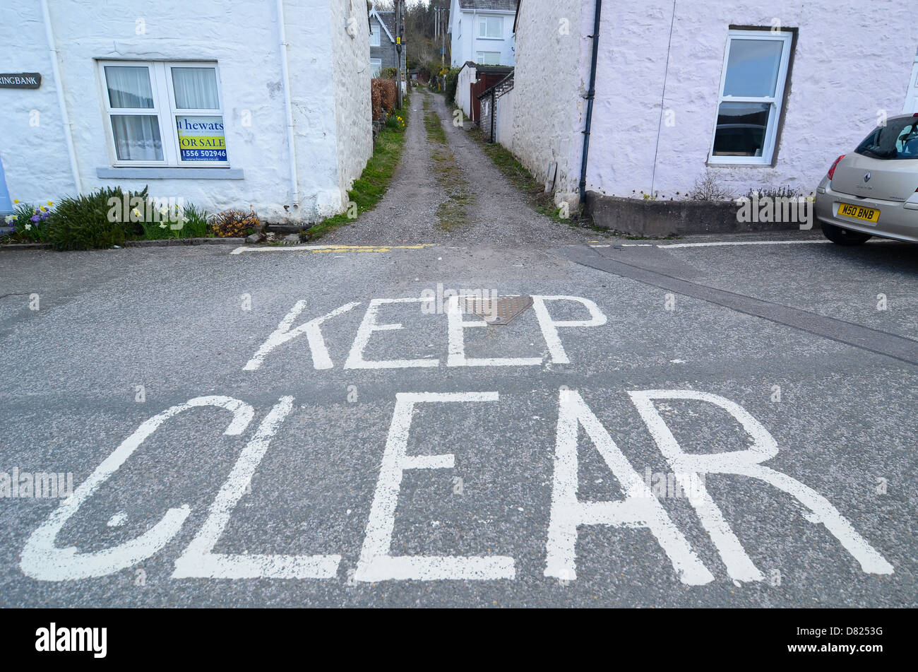 'Keep Clear' written on a road Stock Photo Alamy