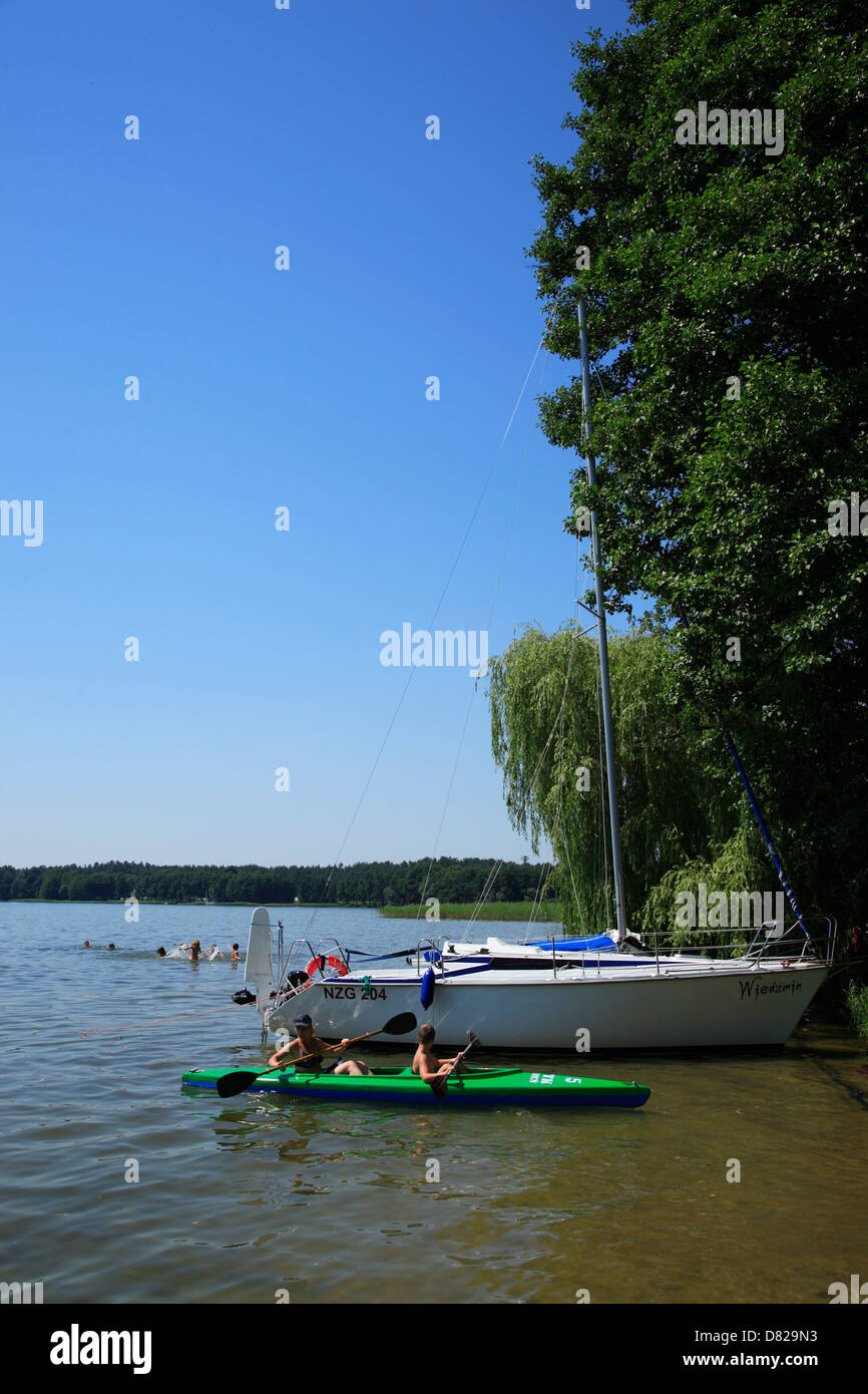 Paddling at a lake, Masurian Lake District, Poland Stock Photo