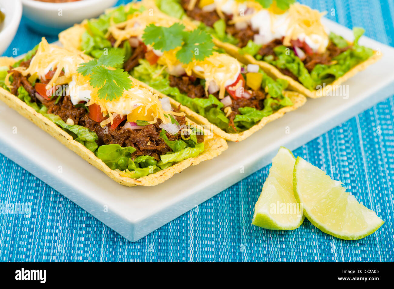 Beef Tacos Shredded beef taco trays topped with salsa, sour cream and