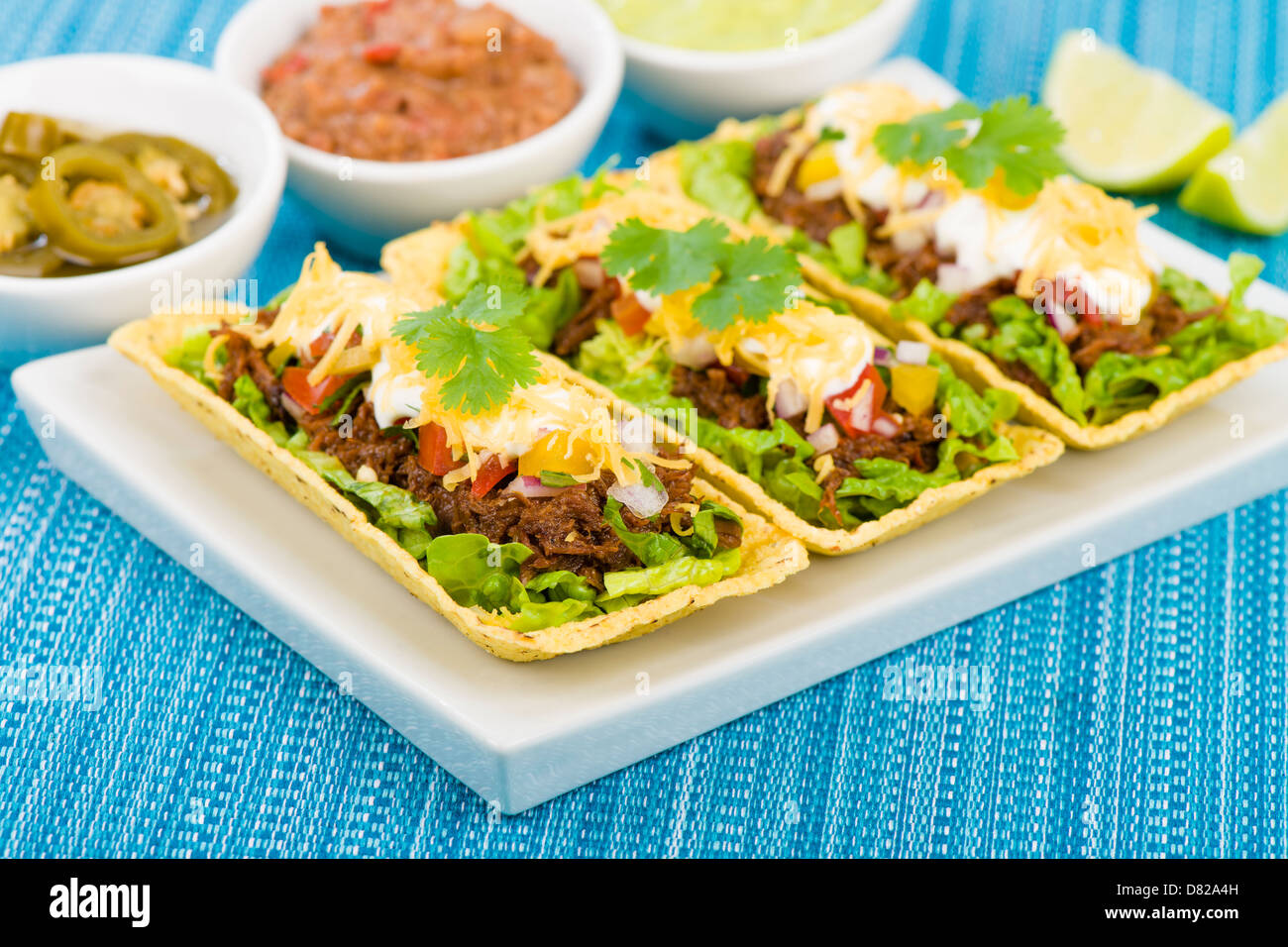 Beef Tacos Shredded beef taco trays topped with salsa, sour cream and