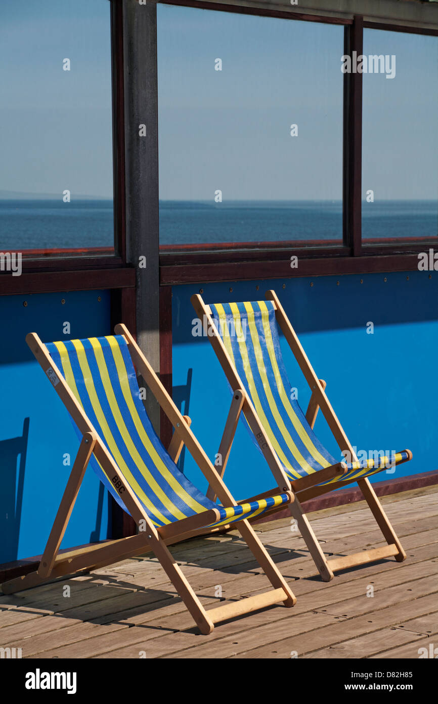 Empty deckchairs on Bournemouth Pier in May Stock Photo