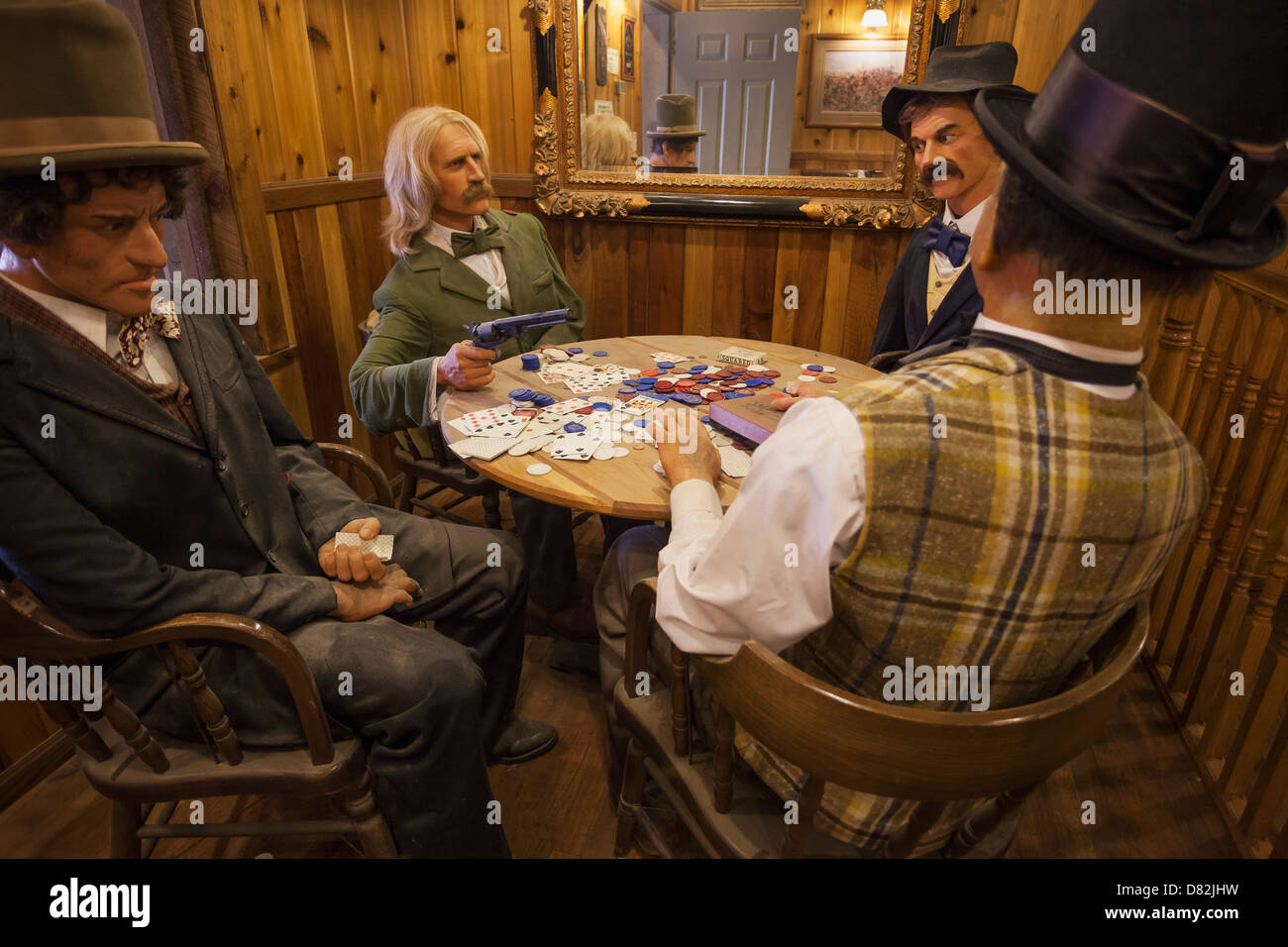 Western figures play poker inside Wall Drug store in Wall, South Dakota Stock Photo