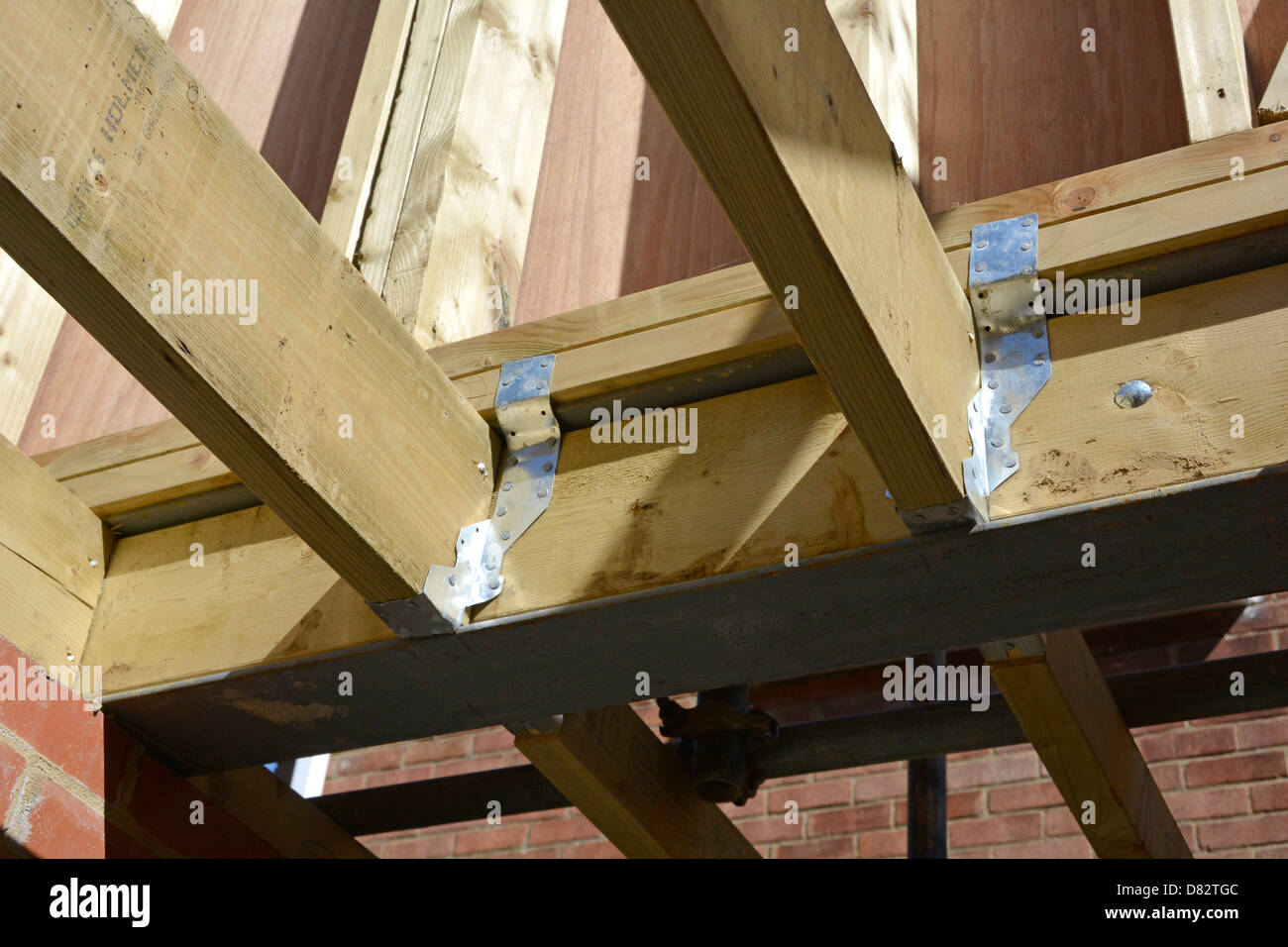 Timber floor joists & pressed steel joint connectors to new first floor  house extension Essex England UK see "More Info" note below Stock Photo -  Alamy