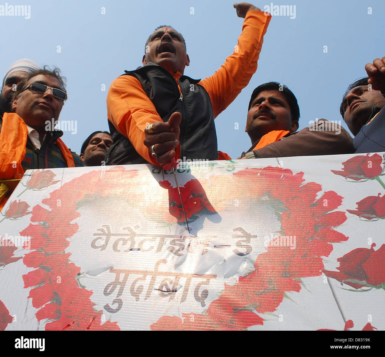 Activists of the conservative organization Shiv Sena shout anti-Valentine's  day slogans as they tear a banner with an Stock Photo - Alamy