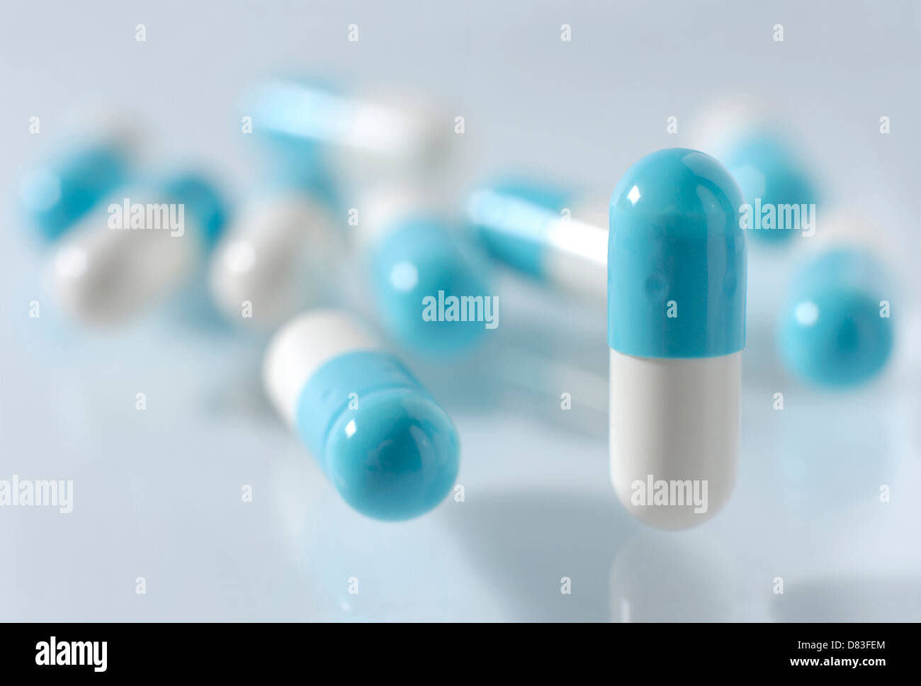 White-blue capsules Medication pills isolated on white background Stock Photo