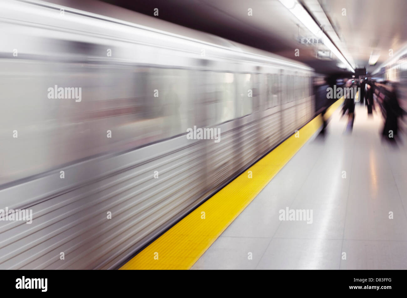 Subway train arriving to a platform with an artistic motion blur and zoom effect. TTC, Toronto, Canada. Stock Photo