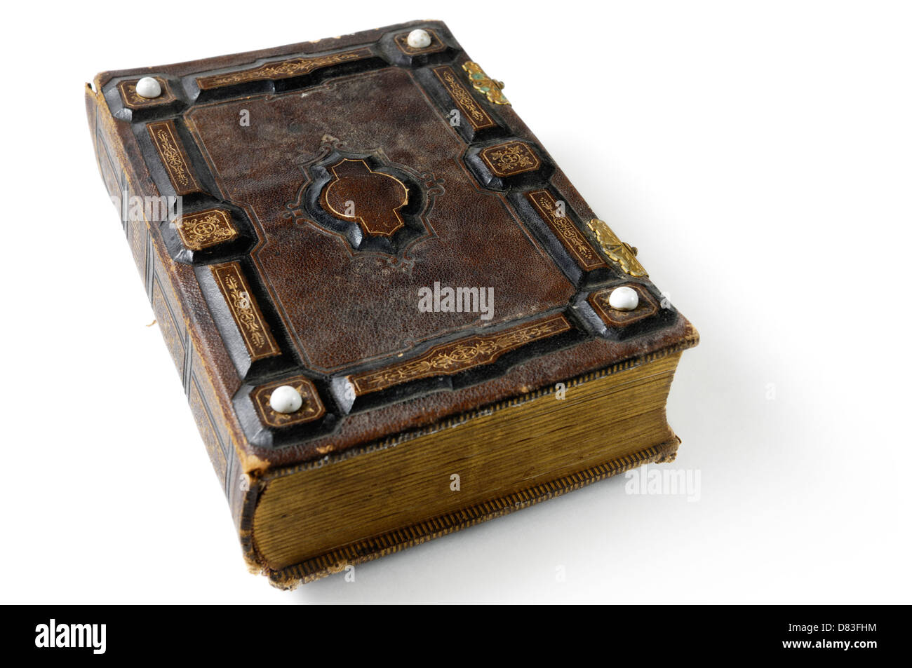 Closeup of rustic ancient book photo album with hard ornamental leather cover Isolated silhouette on white background Stock Photo