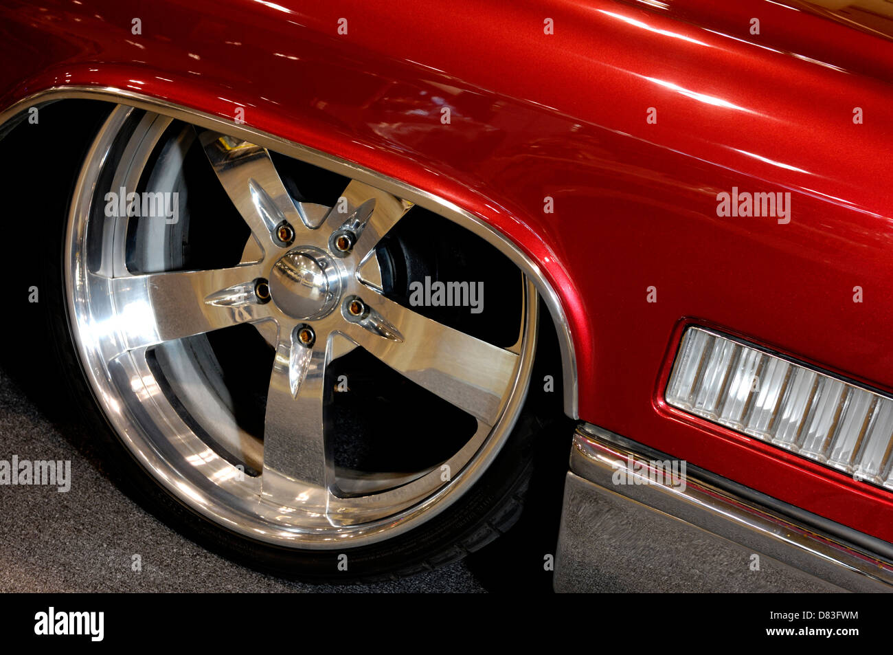 Shiny chrome plated custom low profile classic car wheel rim closeup Stock Photo