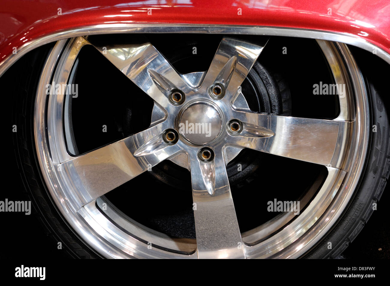 Shiny chromed custom classic car wheel closeup Stock Photo