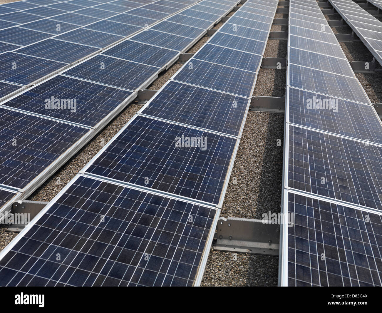 Solar panels on a roof of building Stock Photo