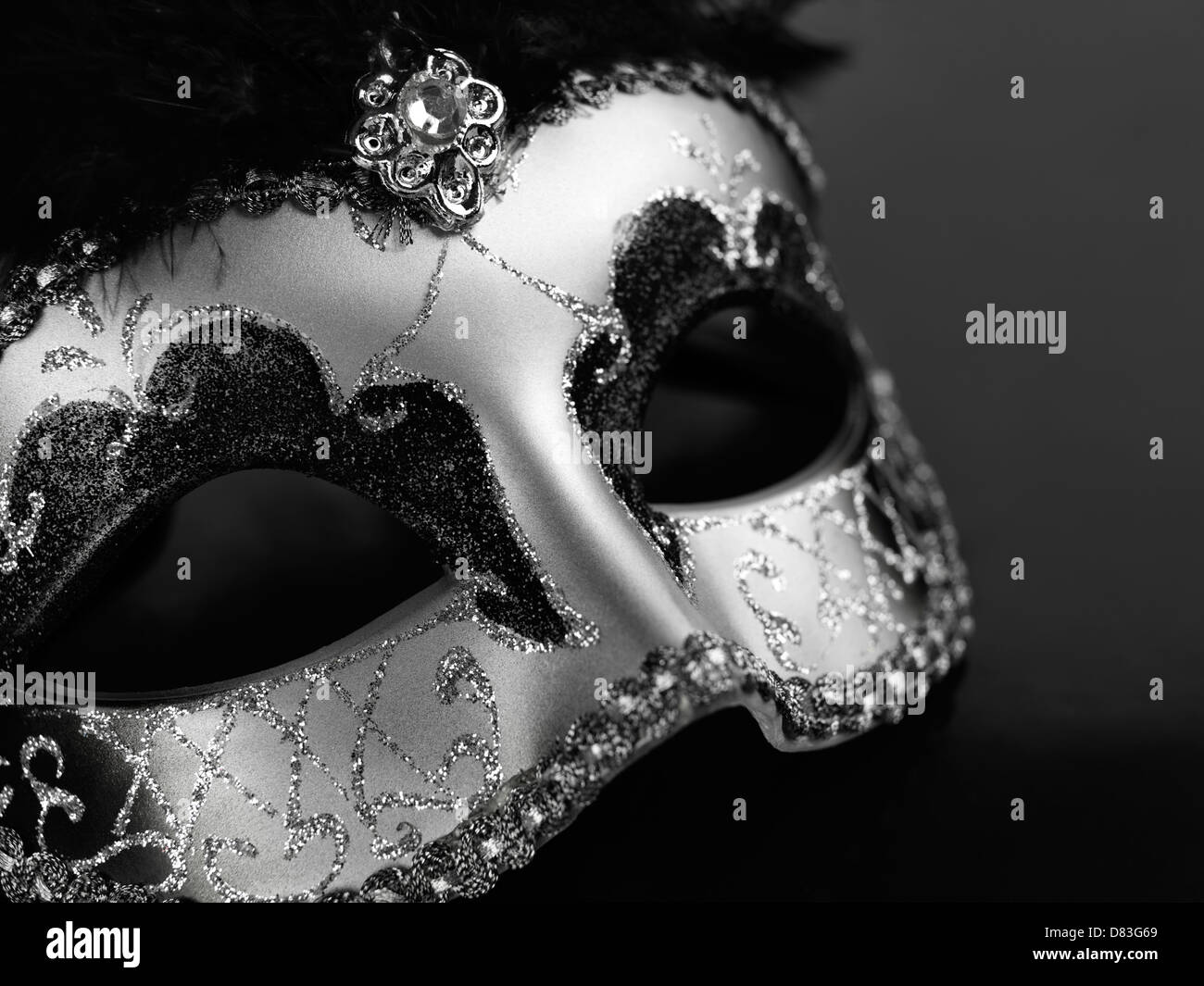 Beautiful silver Venetian mask isolated on black background Stock Photo