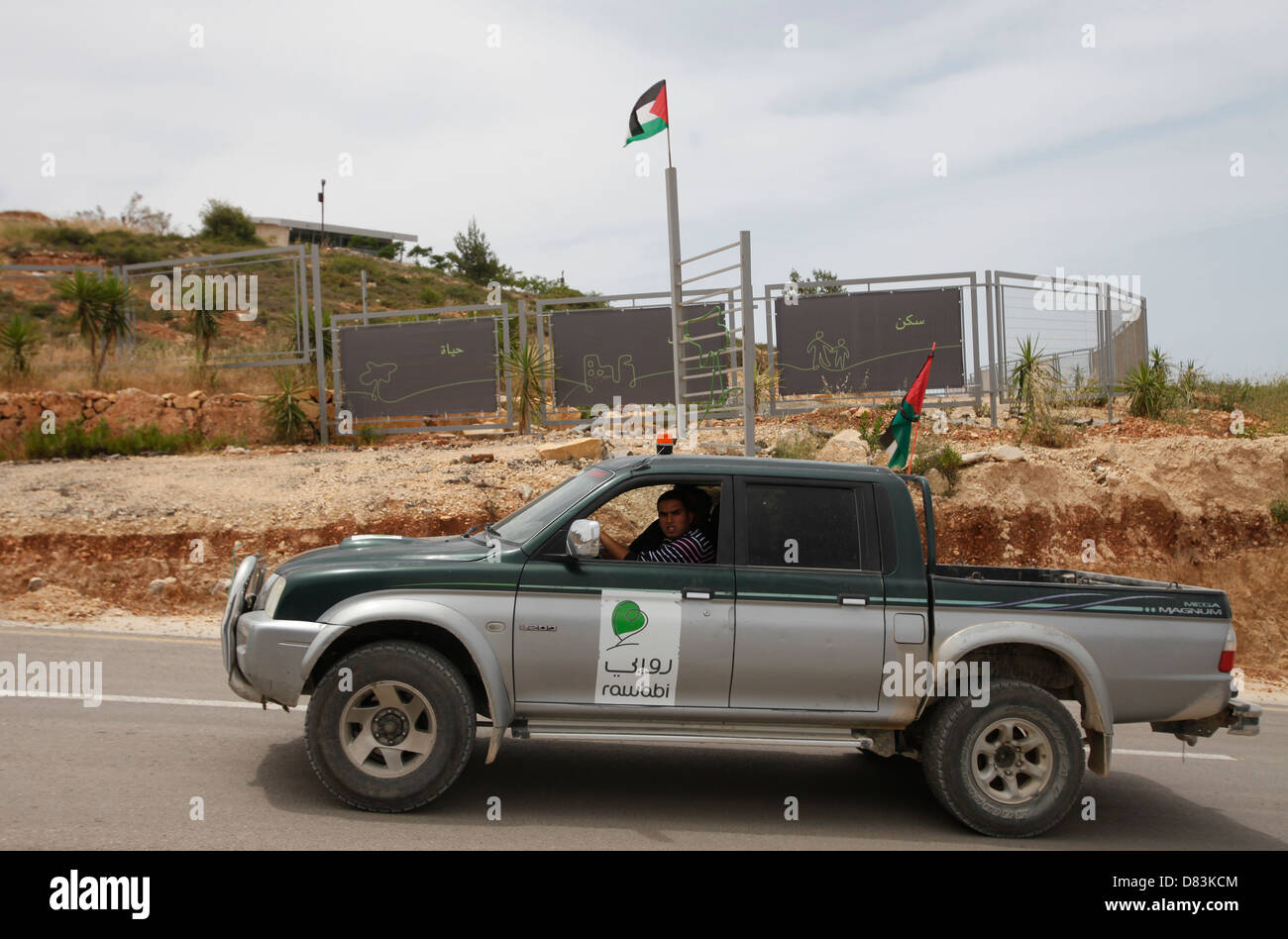 A Palestinian civil security vehicle patrols the construction site of the Palestinian city of