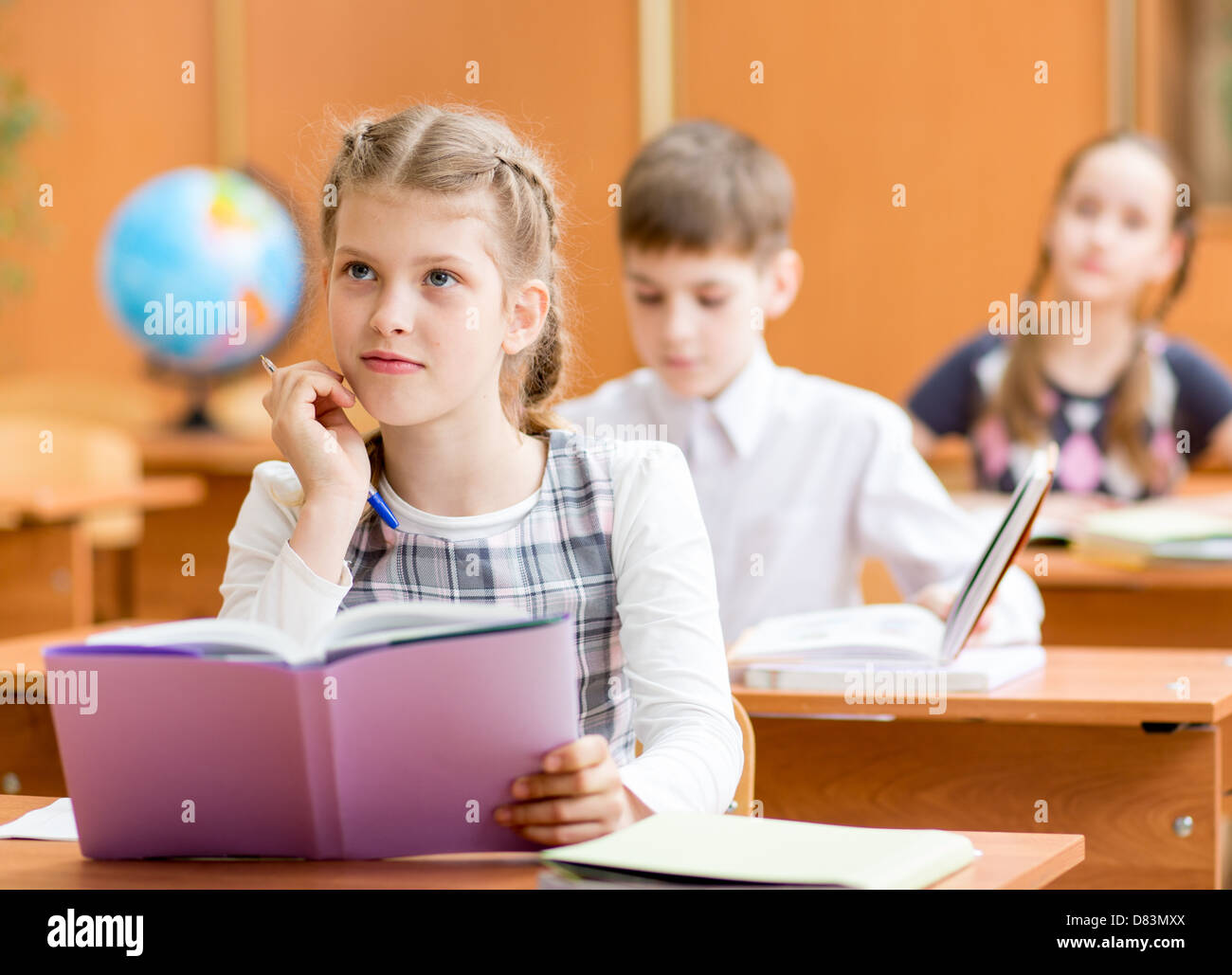 school kids work at lesson Stock Photo