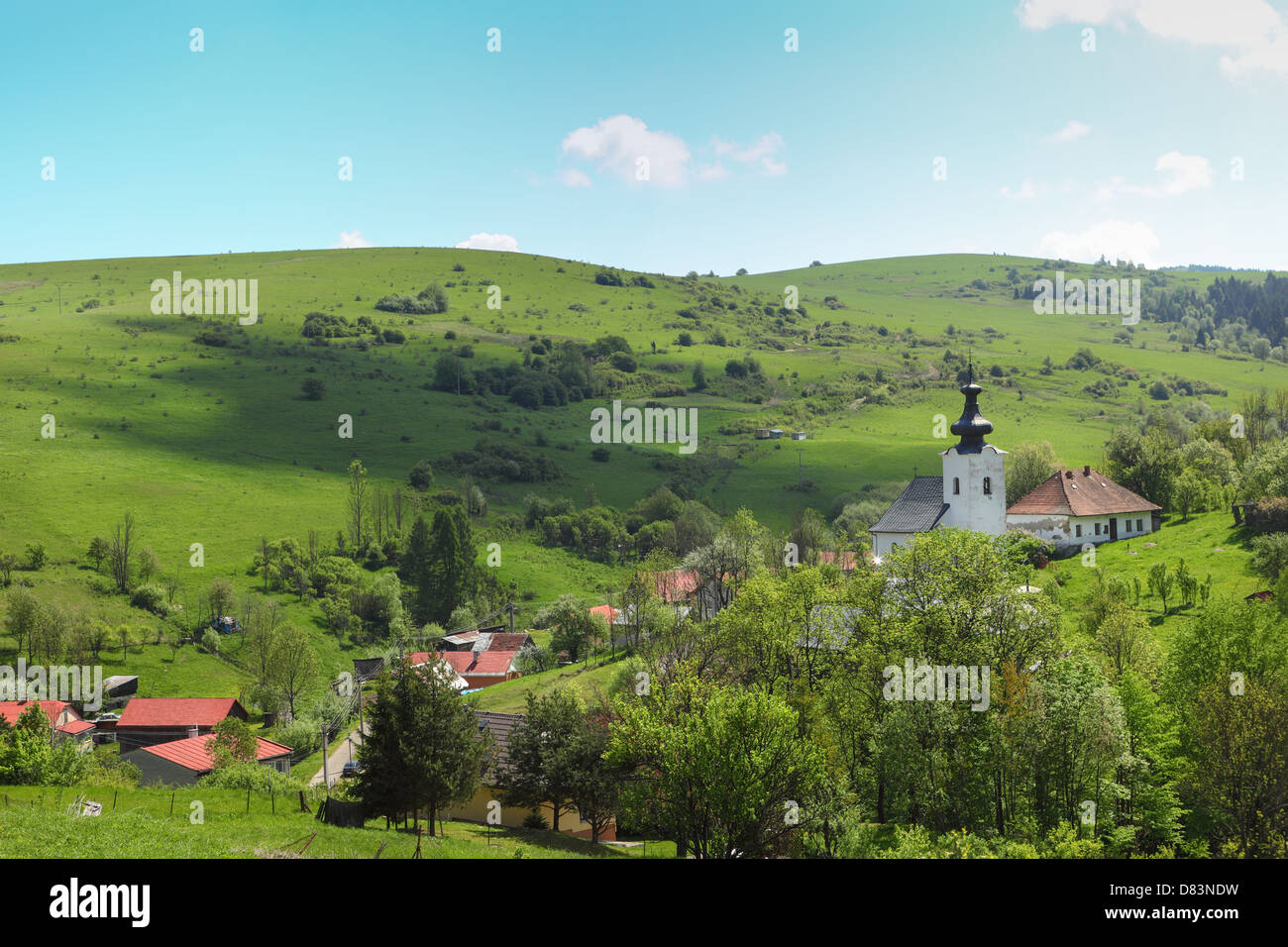 Mountain village in a green valley Stock Photo - Alamy
