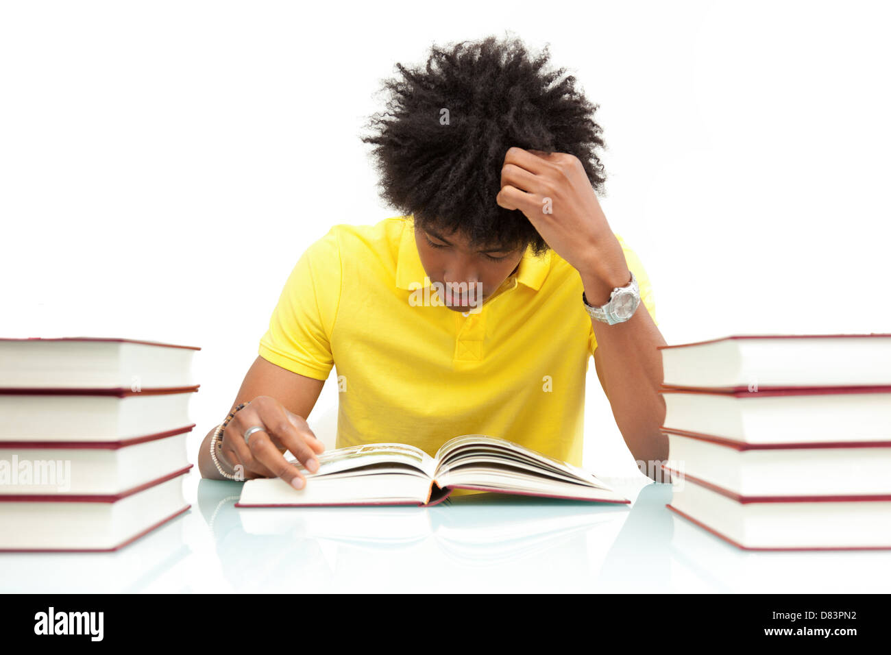 Young african american student reading books, over white background - African people Stock Photo