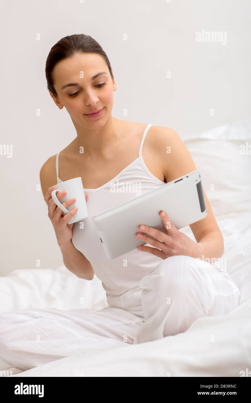 Pretty woman surfing on the internet at home Stock Photo