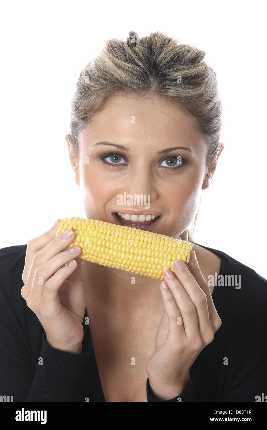 Young Woman Eating A Freshly Cooked Healthy Vegetarian Corn on the Cob