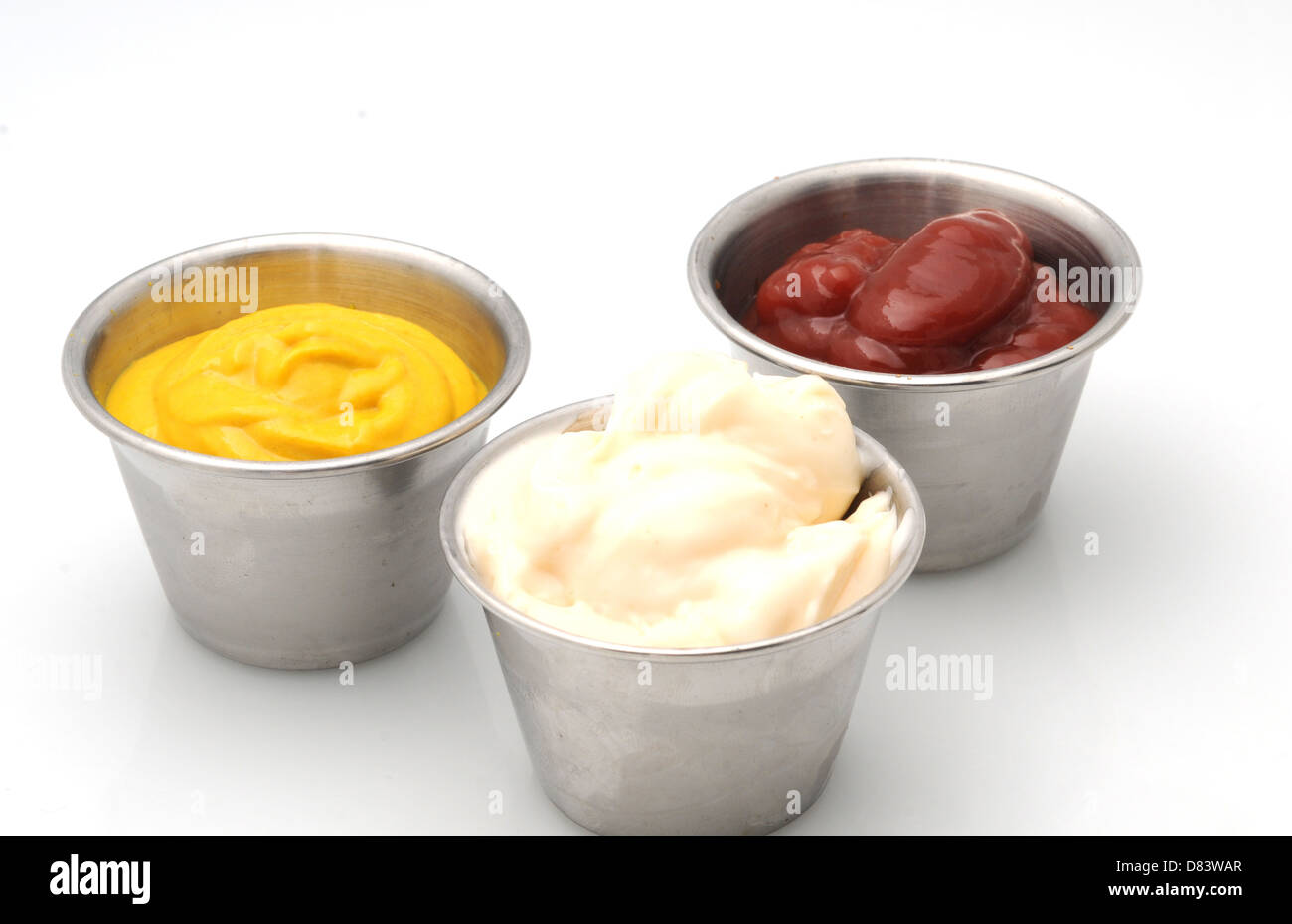 Ketchup, mustard and mayonnaise in small metal bowls Stock Photo Alamy