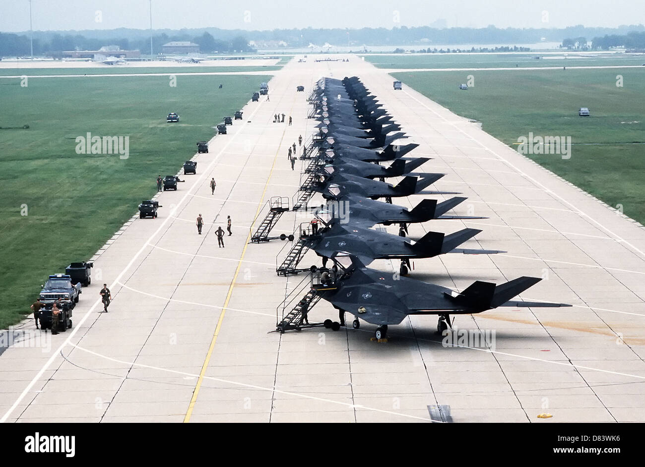 US Air Force F-117A Stealth fighter aircraft assigned to the 37th Tactical Fighter Wing line the runway during an overnight stop on their way to Saudi Arabia for the Iraq War September 5, 2002 at Langley Air Force Base, VA. Stock Photo