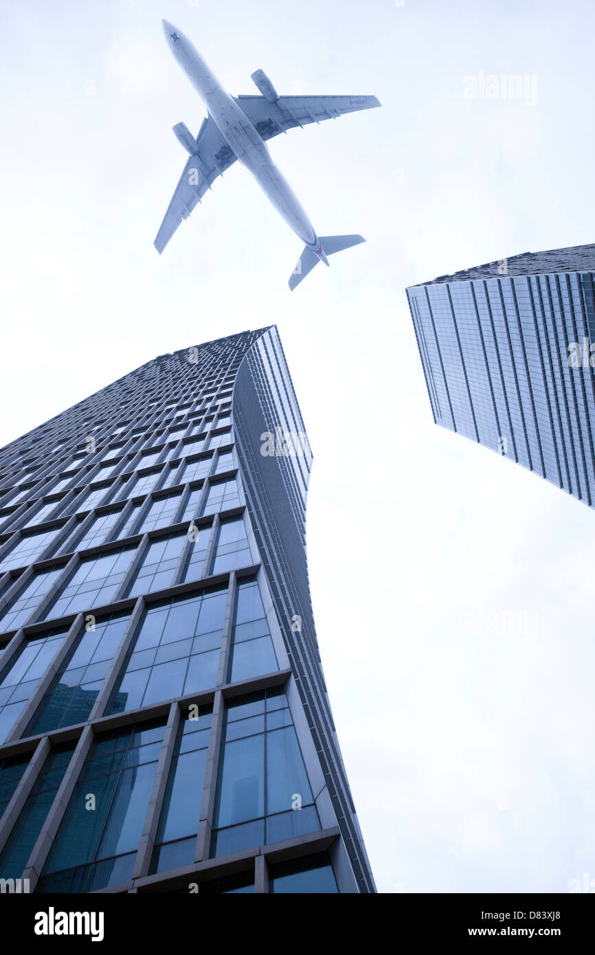 Plane flying buildings hires stock photography and images Alamy