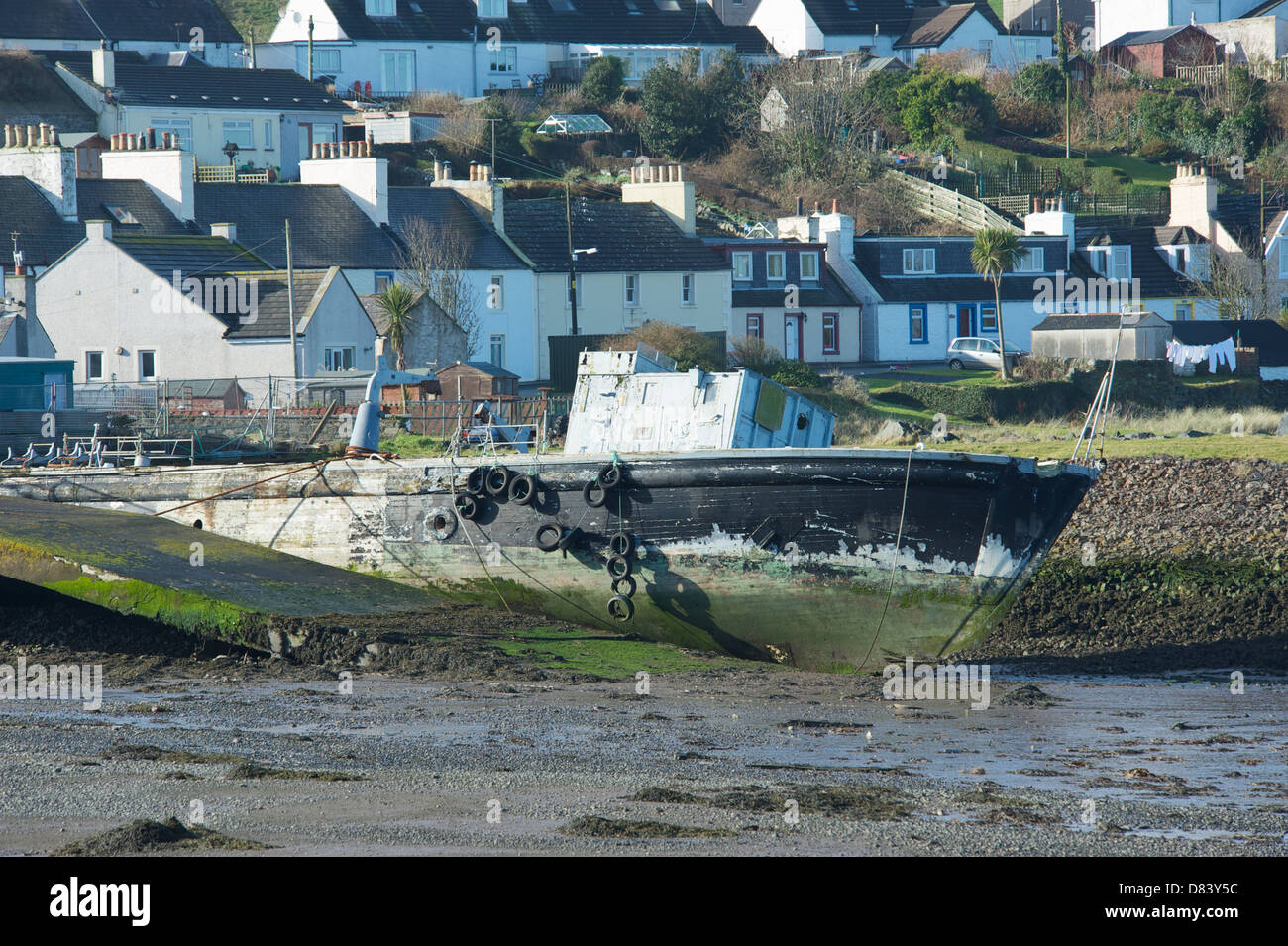 The remains of HMS Pagham, at Drummore harbour, The Rhines, Dumfries and Galloway, Scotland, where she awaits her fate. Stock Photo