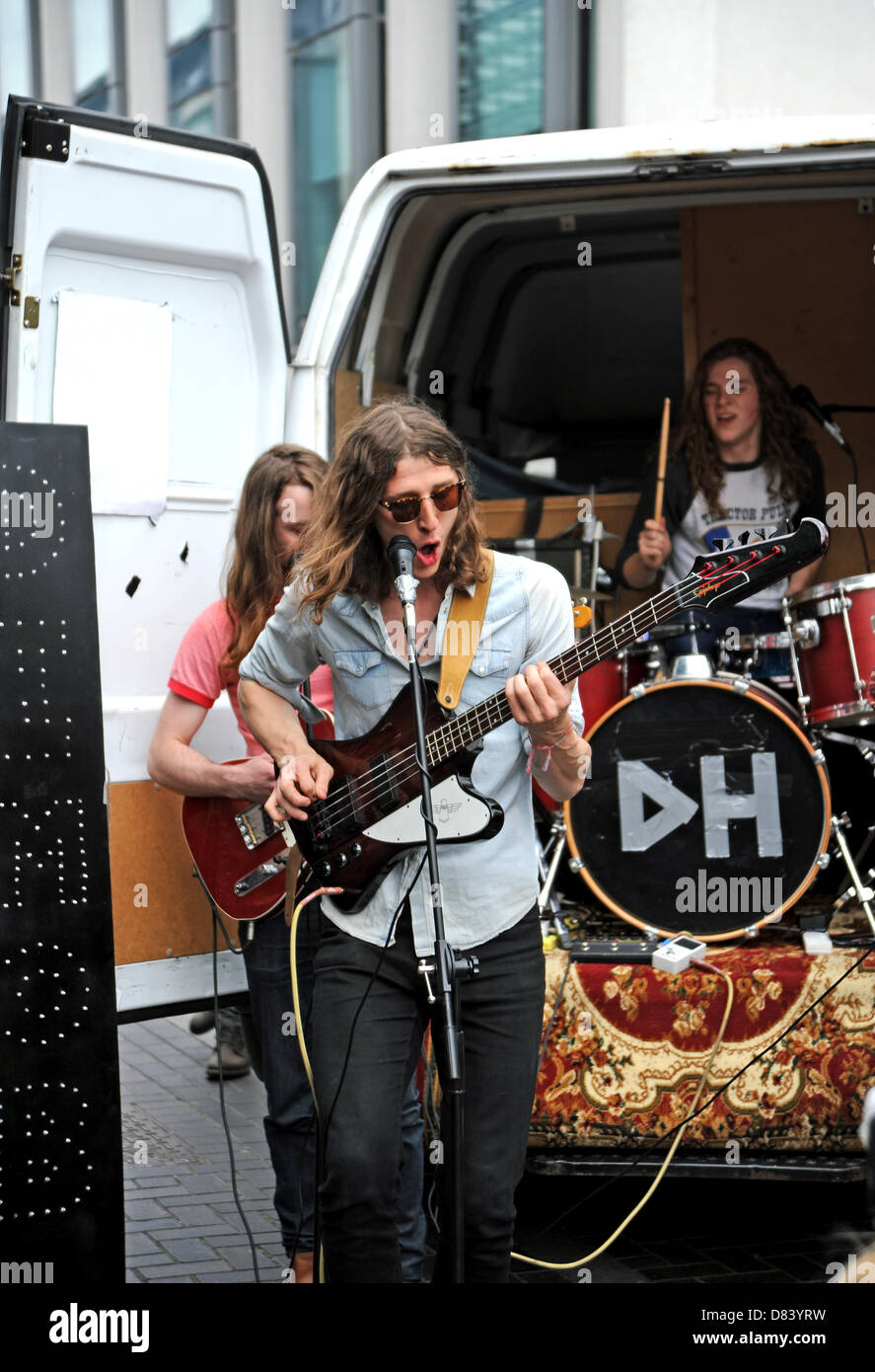 The rock band Demob Happy play to a crowd out of the back of their van