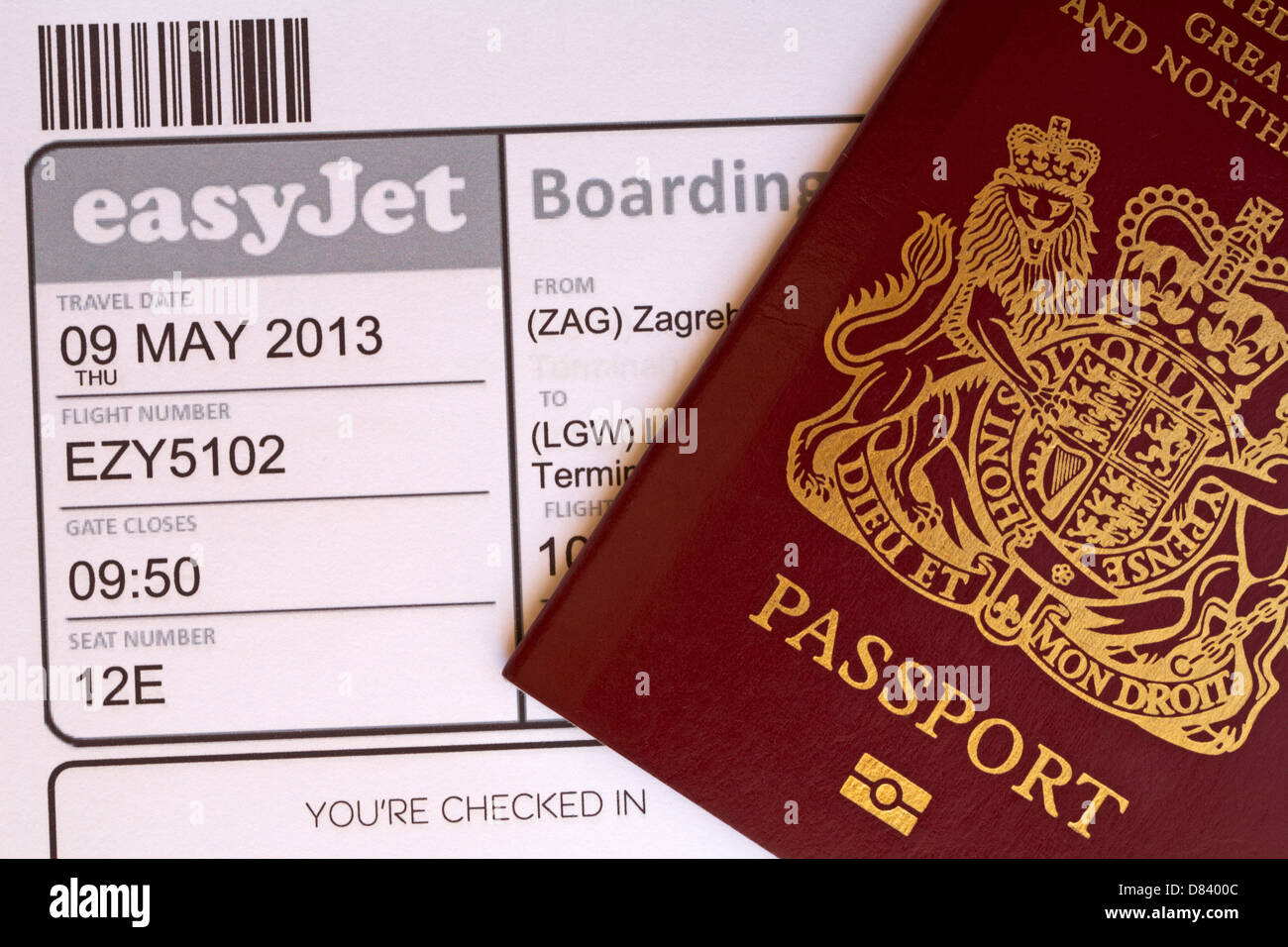 UK passport and Easyjet boarding pass for flight to Zagreb in Croatia Stock Photo