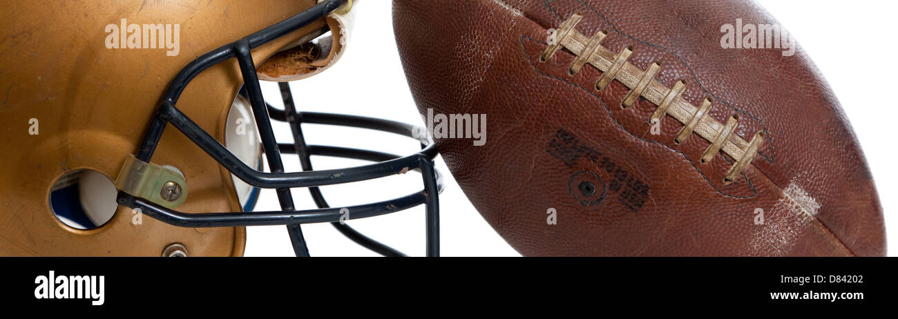 A retro football helmet and football on a white background Stock Photo