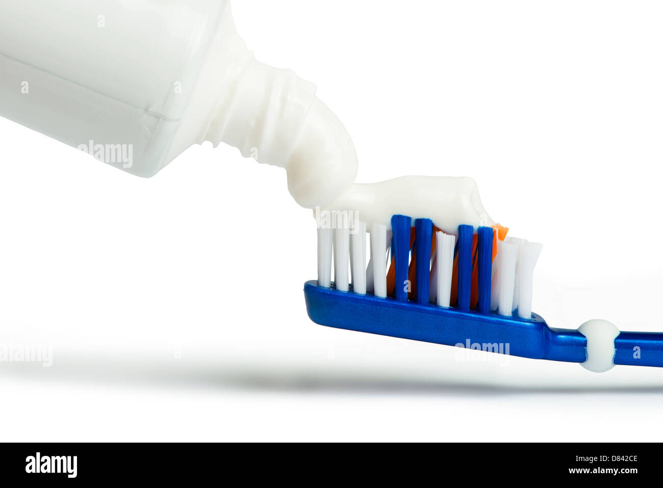 Blue toothbrush toothpaste white isolated studio shot Stock Photo - Alamy